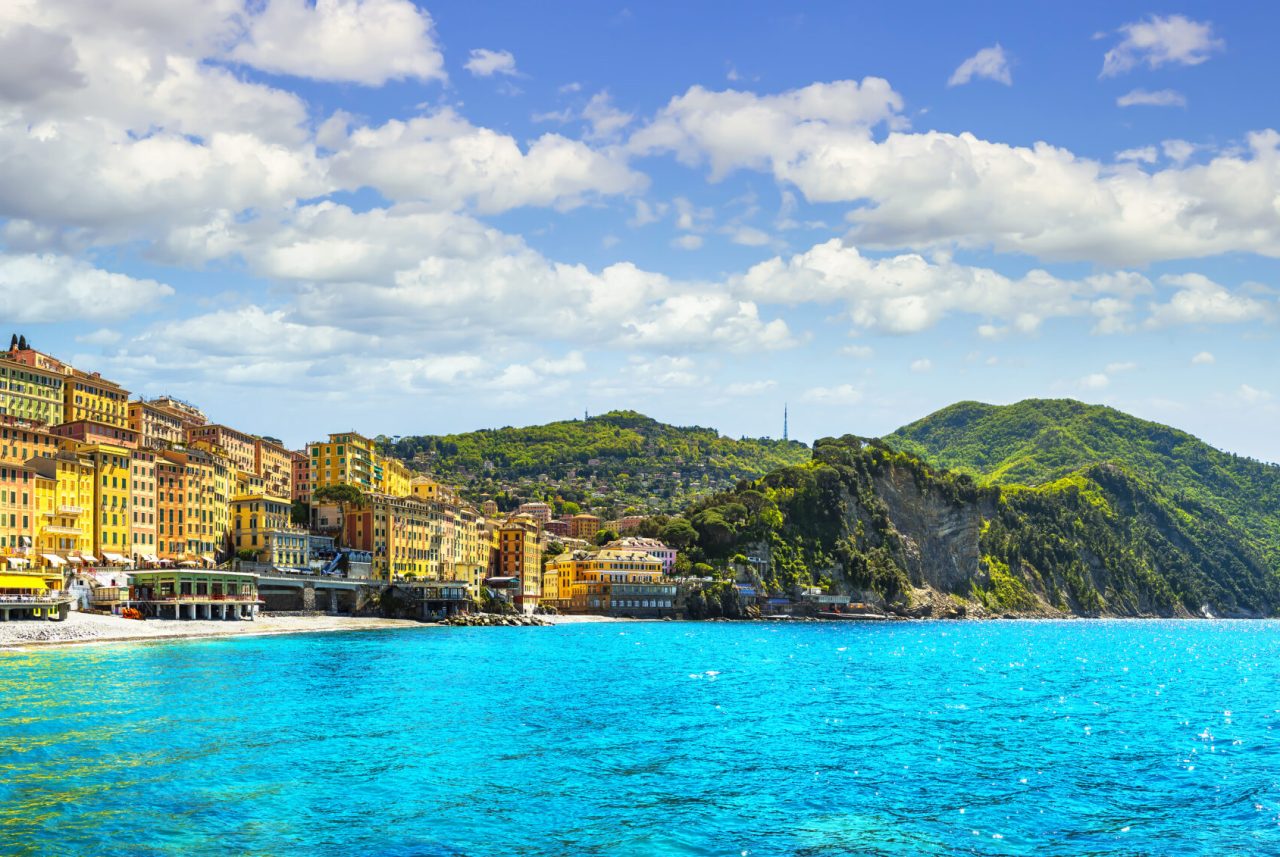 Camogli beach and typical colorful houses. Travel destination Ligury, Italy, Europe.